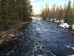 Вид с автомобильного моста по течению.