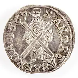 Талер 1667 года, где апостол держит крест перед собой.