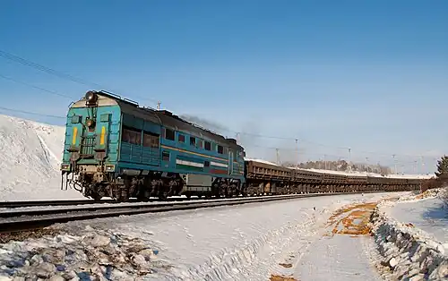 Локомотив 2ТЭ116-1106 УГОК перевозит горную породу на станции Рудная