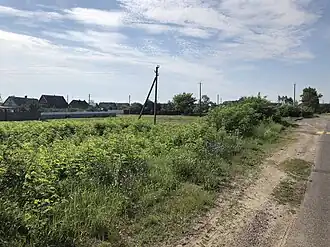 Вид с шоссе на деревню, июль 2018 года