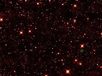 Астероид 2010 TK7(обведён зелёным кружком, внизу справа)