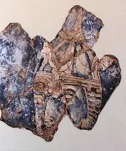 Бунджикат, фигура в остроконечном шлеме с полумесяцем