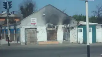 Сгоревшее здание в Оше. Год спустя после событий.