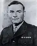 A black and white image of Charles Barrett, a white male in his Marine Corps dress uniform