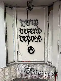 "Deny Defend Depose" graffiti in Miami Beach, Florida