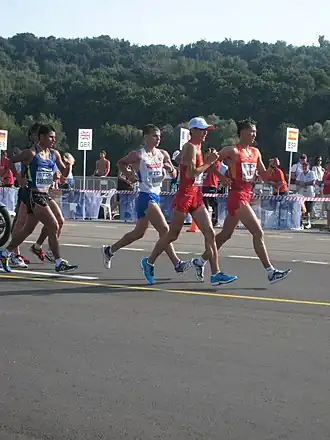 Эрик Баррондо (крайний слева) с Александром Ивановым, Чэнь Дином и Чжэнь Ванем