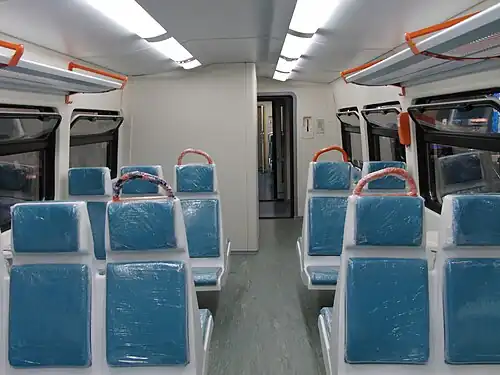 Пассажирский салон пригородного класса