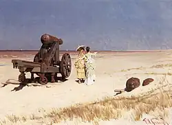 Женщины на берегу около старых пушек