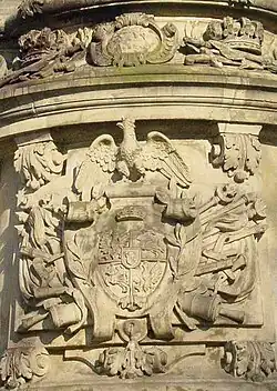 Герб короля: Орёл и Погоня, в центре щита герб Собеских Янина