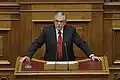 Премьер-министр Греции Лукас Пападимос выступает за меры бюджетной экономии в парламенте, 18 ноября 2011