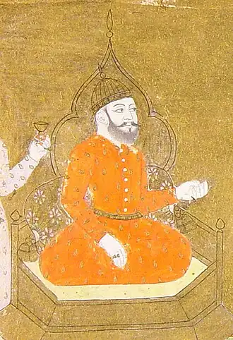 могольская картина, изображающая Мухаммада ибн Туглака сидящим на шестиугольном золотом троне в позе лотоса