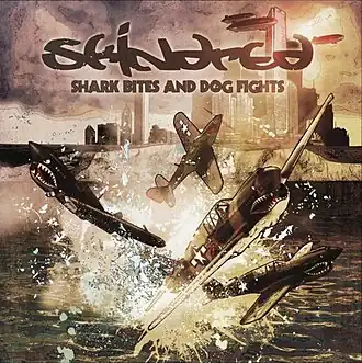 Обложка альбома Skindred «Shark Bites and Dog Fights» (2009)