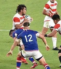 Дмитрий Герасимов (номер 12) и Сёта Хорие на чемпионате мира 2019