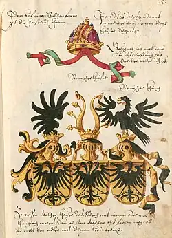 Герб для императора Священной Римской империи Фридриха III, разработанный Конрадом Грюненбергом в 1483 году. Одноглавый орёл символизирует Германию, двуглавый — Священную Римскую империю, а трёхглавый — Рим