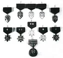 Комплект наград УПА, изъятый сотрудниками КГБ при аресте Василия Кука-«Лемиша», главного командира УПА 23 мая 1954 года. Кресты Боевой Заслуги представлены под номерами 1—5