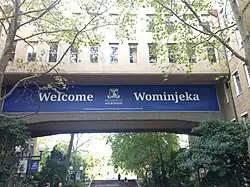 Building signage says Welcome — Wominjeka